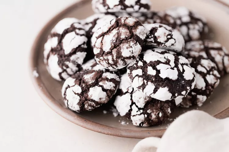 Chocolate crinkle cookies covered with powdered sugar