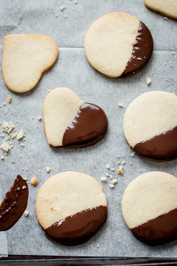 Shortbread cookies dipped in chocolate and decorated for Christmas