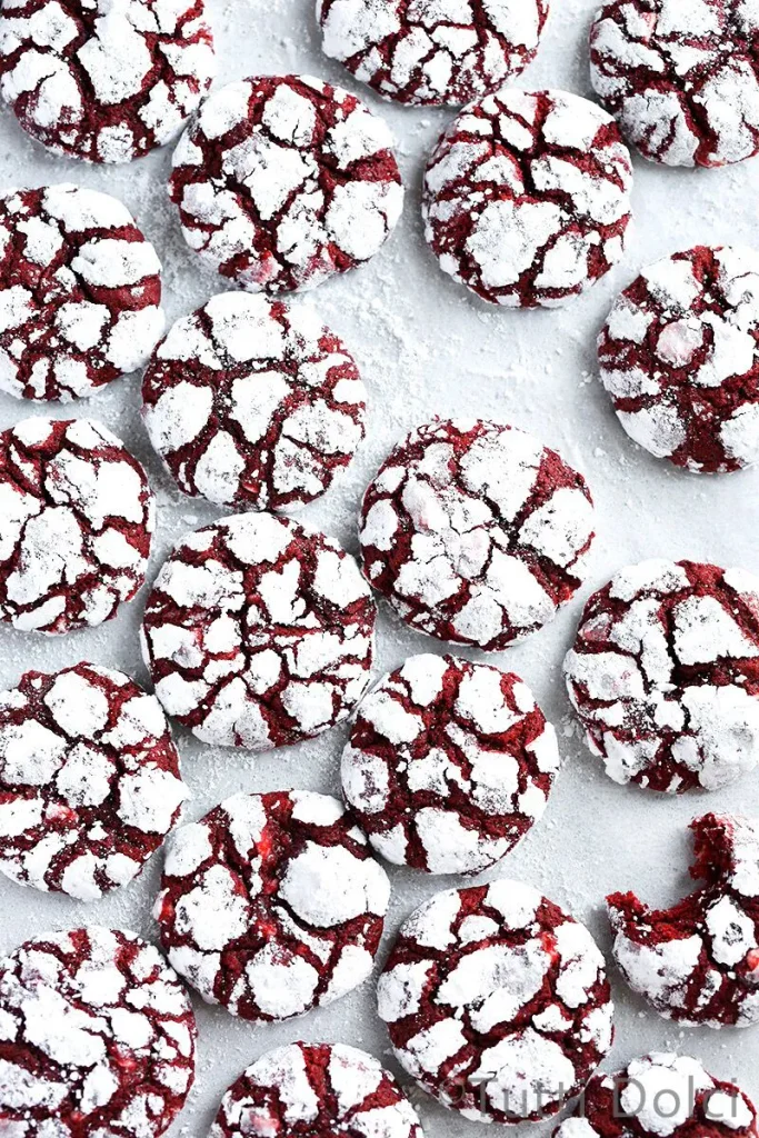Red velvet crinkle cookies dusted with powdered sugar
