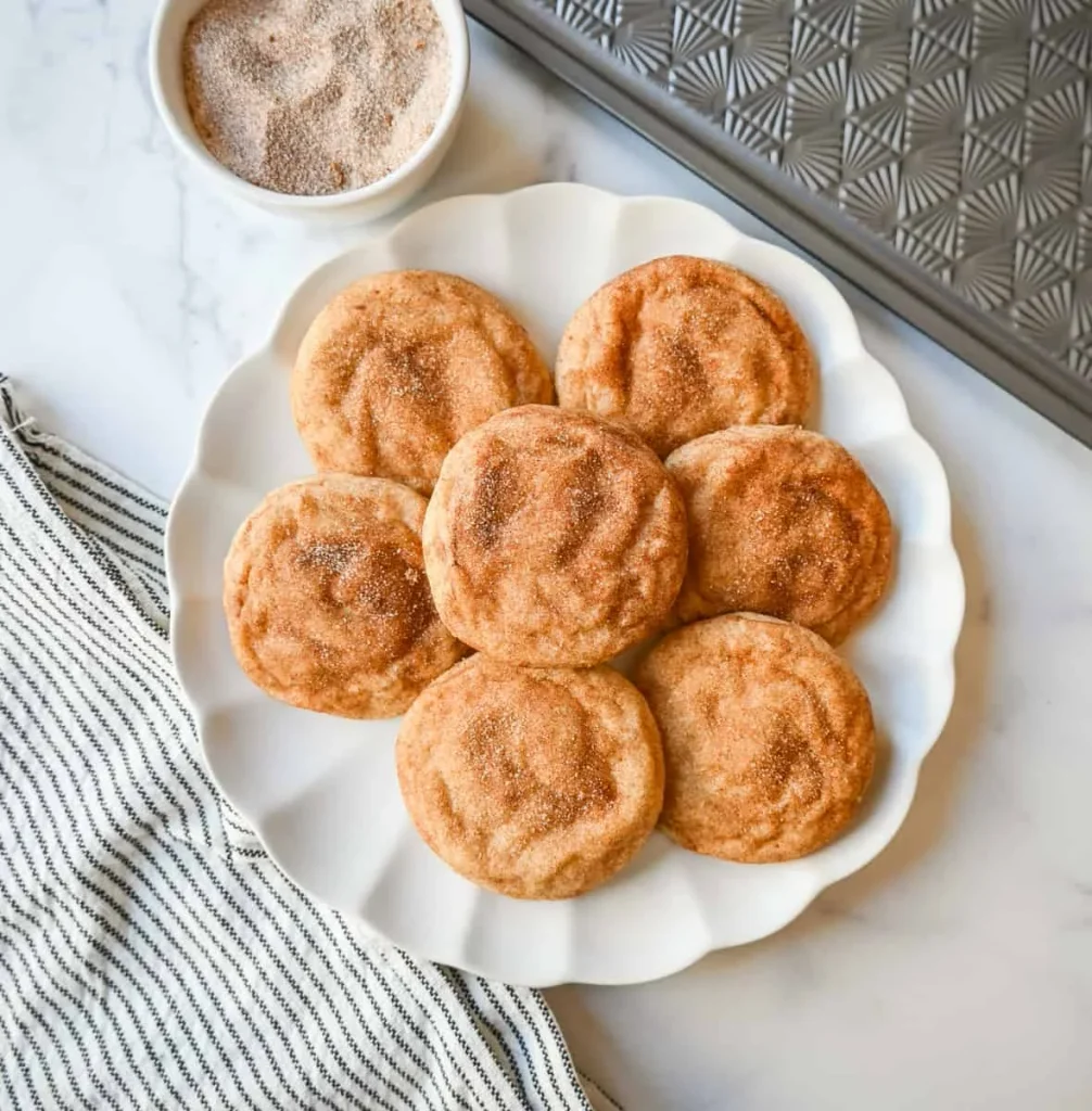 Soft cinnamon sugar snickerdoodle cookies on a Christmas plate