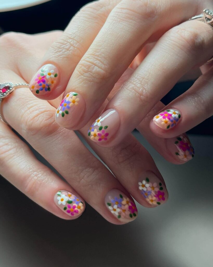 A collection of flower nails featuring spring nail colors, summer flower nails, hand-painted floral nail designs, and elegant pastel nail art.