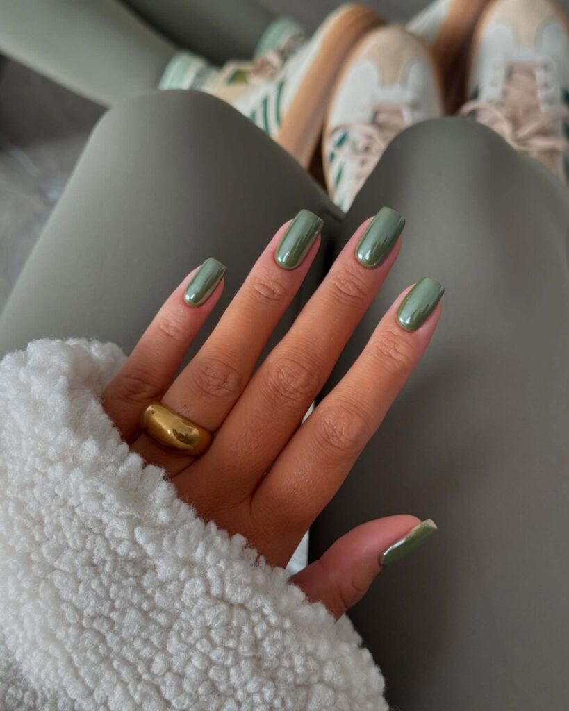 A stunning collection of green nail designs, featuring neon green nails, dark green stiletto nails, and mint green manicures.