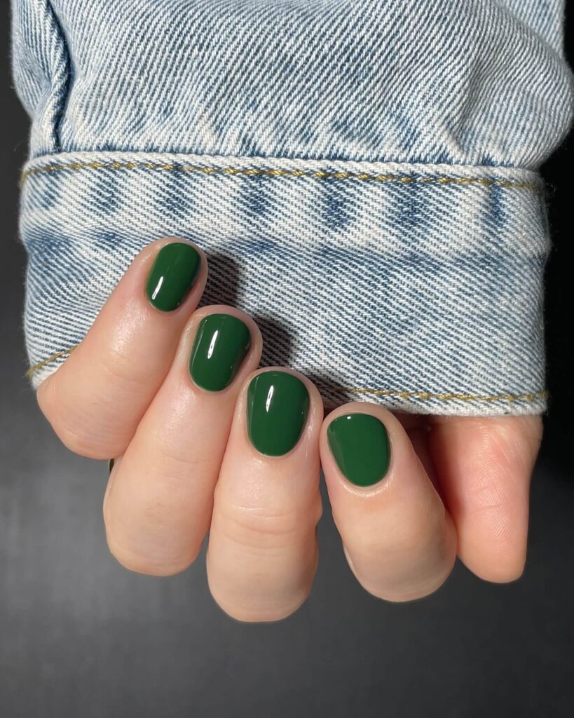 A stunning collection of green nail designs, featuring neon green nails, dark green stiletto nails, and mint green manicures.