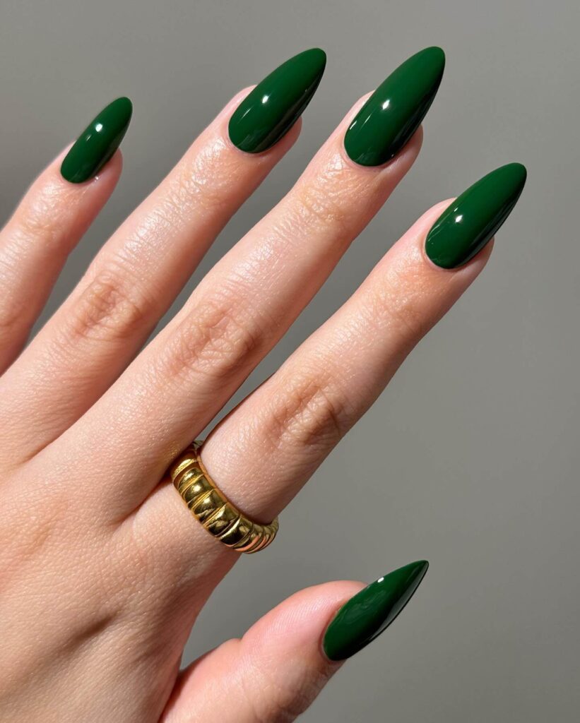 A stunning collection of green nail designs, featuring neon green nails, dark green stiletto nails, and mint green manicures.