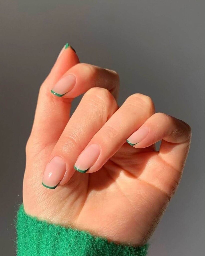 A stunning collection of green nail designs, featuring neon green nails, dark green stiletto nails, and mint green manicures.