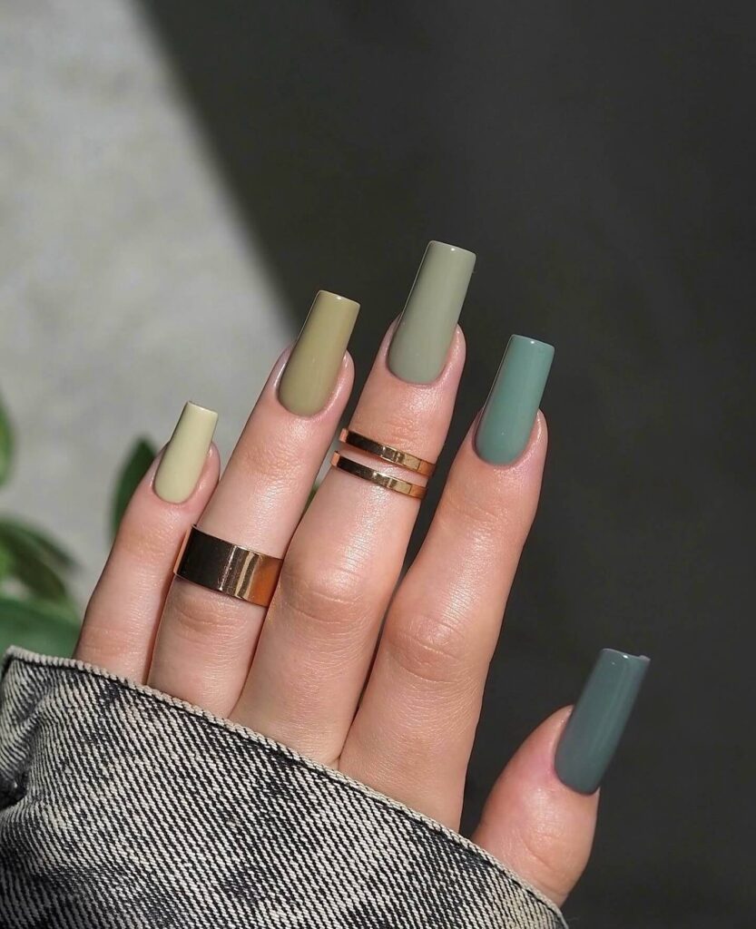 A stunning collection of green nail designs, featuring neon green nails, dark green stiletto nails, and mint green manicures.