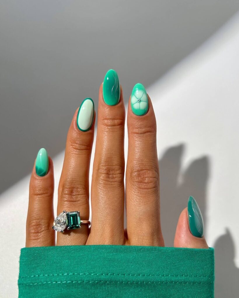 A stunning collection of green nail designs, featuring neon green nails, dark green stiletto nails, and mint green manicures.