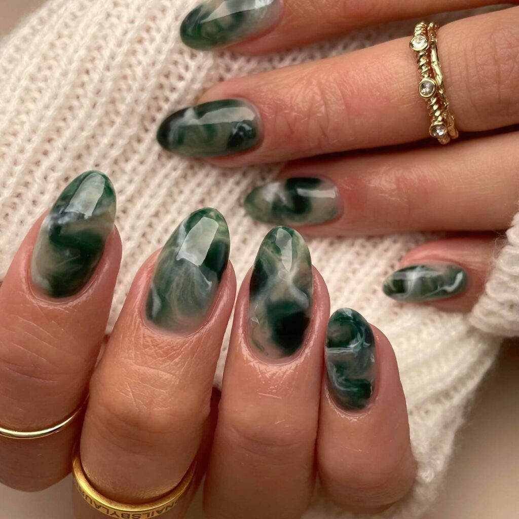 A stunning collection of green nail designs, featuring neon green nails, dark green stiletto nails, and mint green manicures.