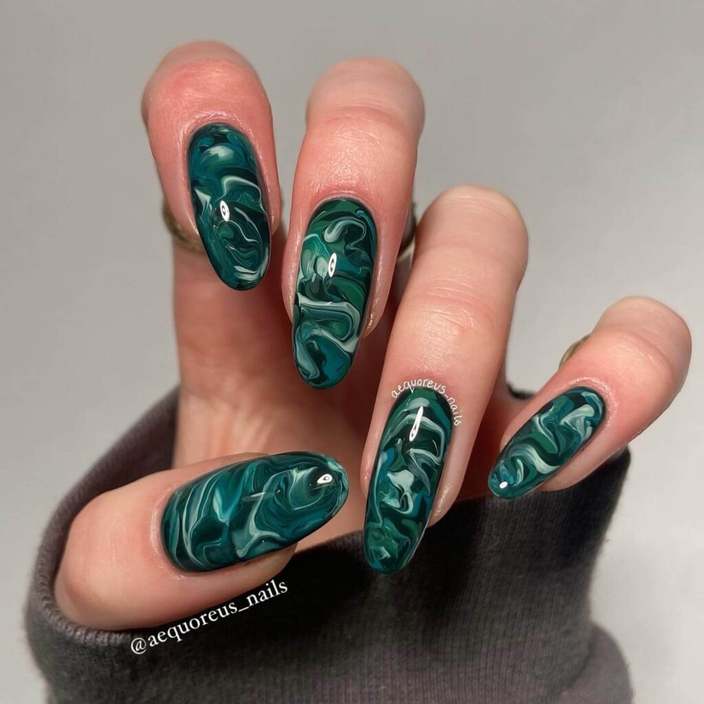 A stunning collection of green nail designs, featuring neon green nails, dark green stiletto nails, and mint green manicures.