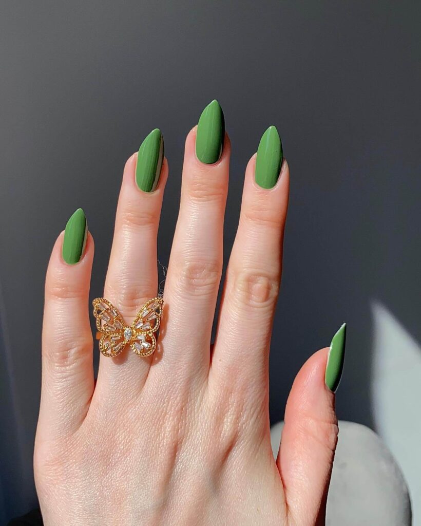 A stunning collection of green nail designs, featuring neon green nails, dark green stiletto nails, and mint green manicures.