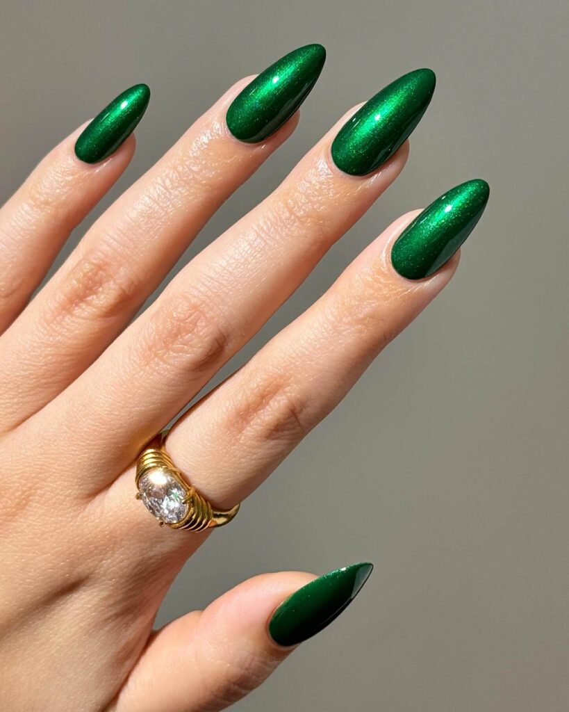 A stunning collection of green nail designs, featuring neon green nails, dark green stiletto nails, and mint green manicures.