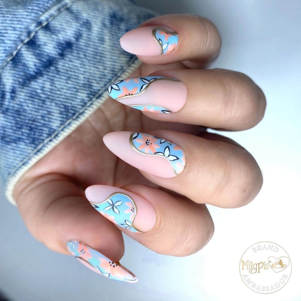 A collection of light blue nails with ombre nail designs, glitter accents, and unique floral patterns showcasing creativity and style.