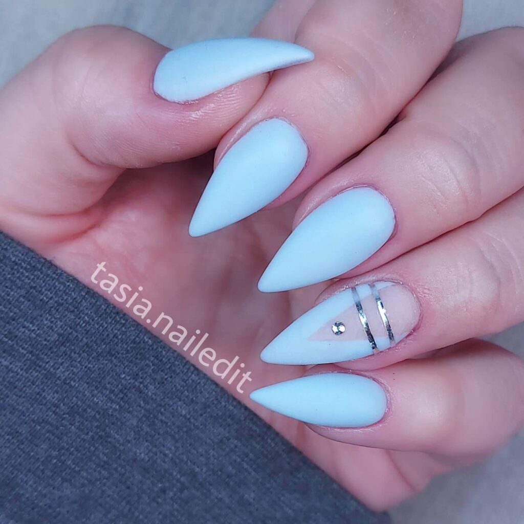 A collection of light blue nails with ombre nail designs, glitter accents, and unique floral patterns showcasing creativity and style.