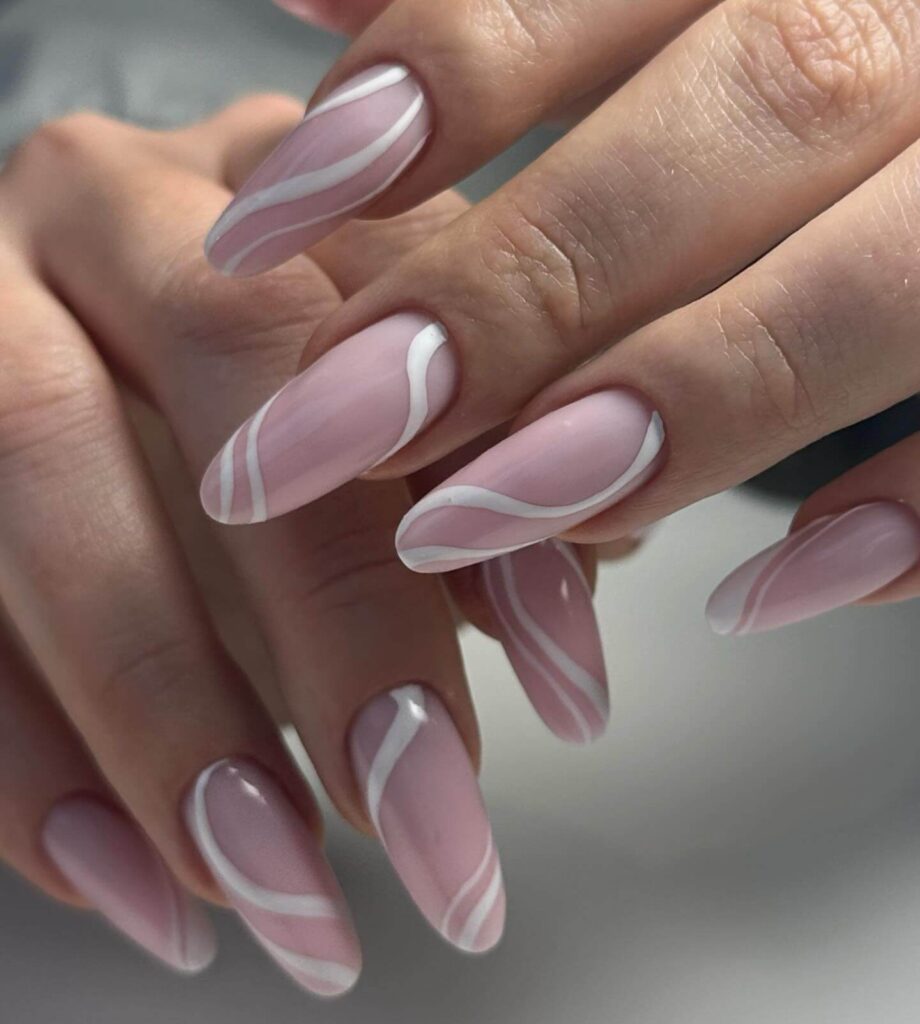 A collection of oval nails featuring glossy, matte, and minimalist designs, perfect for a chic and sophisticated manicure.