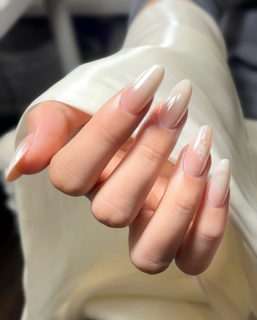 A collection of oval nails featuring glossy, matte, and minimalist designs, perfect for a chic and sophisticated manicure.