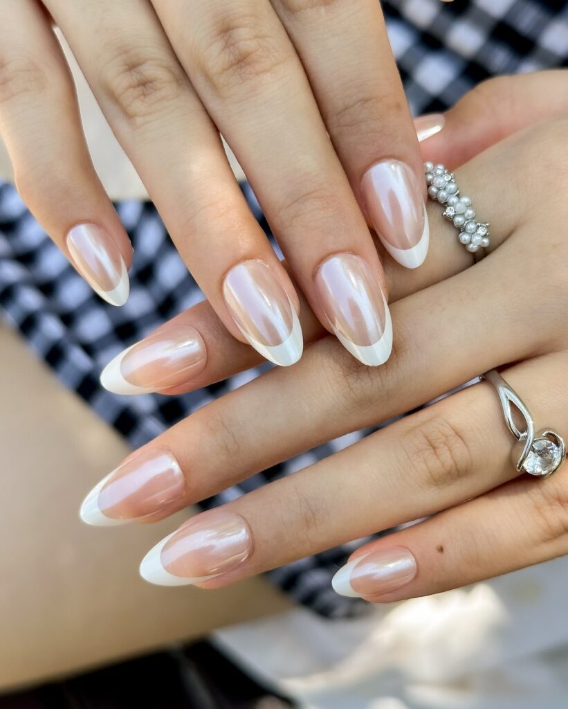 A collection of oval nails featuring glossy, matte, and minimalist designs, perfect for a chic and sophisticated manicure.