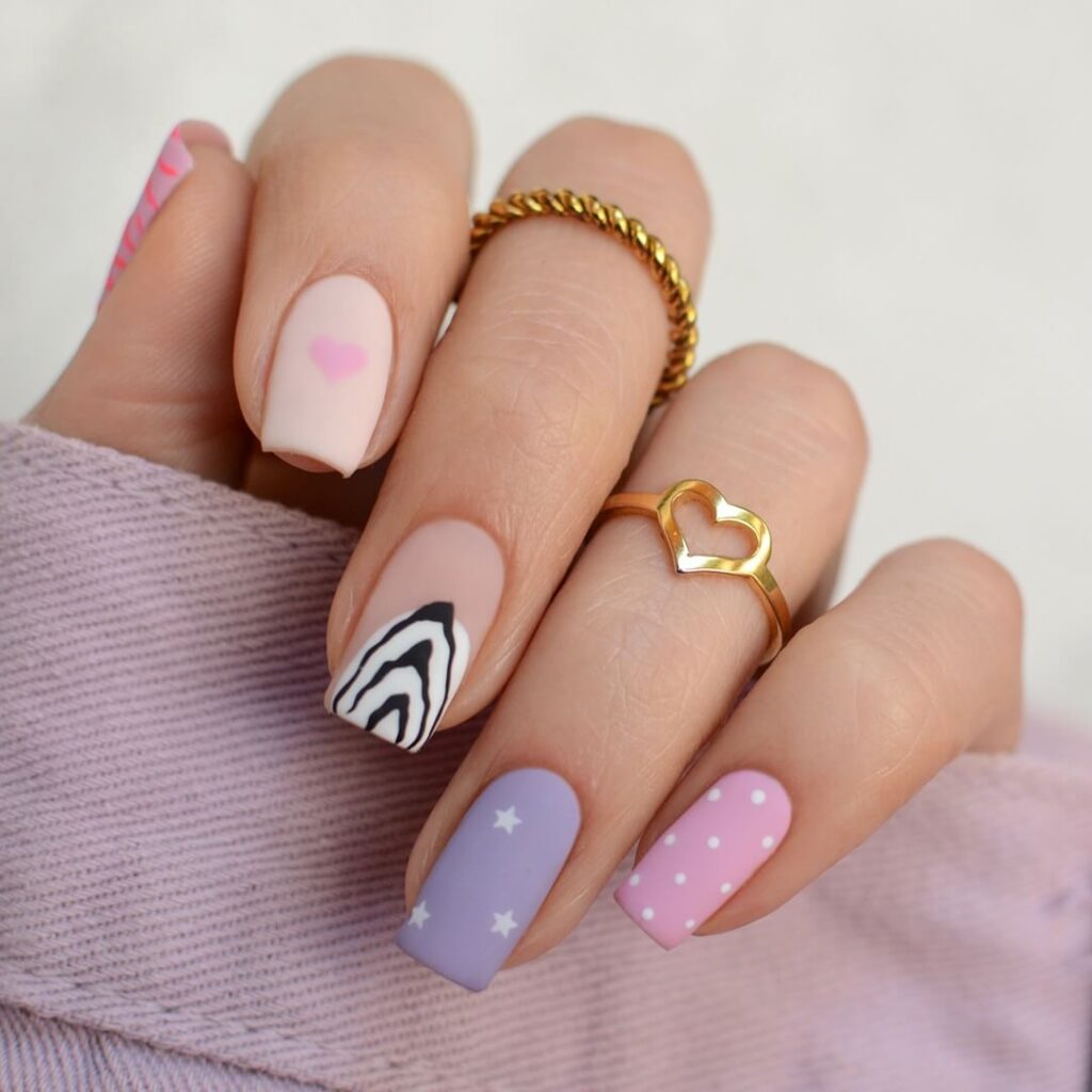 A stunning array of pastel nails with marble nail art and colorful pastel nail polish designs.
