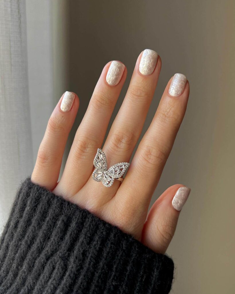 Elegant pearl nails featuring natural to acrylic designs, explore pearl nails for weddings, proms, and formal occasions.