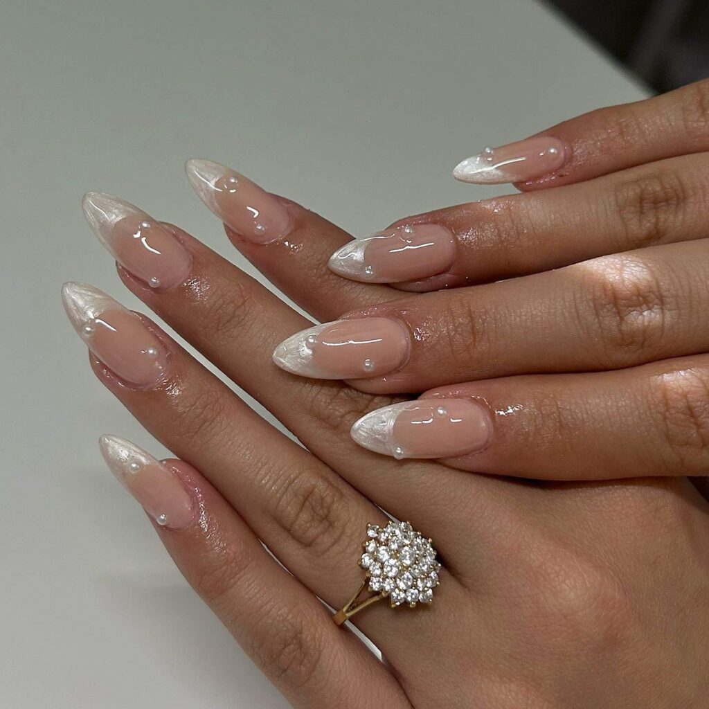 Elegant pearl nails featuring natural to acrylic designs, explore pearl nails for weddings, proms, and formal occasions.