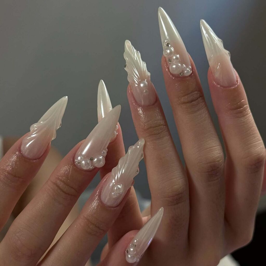 Elegant pearl nails featuring natural to acrylic designs, explore pearl nails for weddings, proms, and formal occasions.