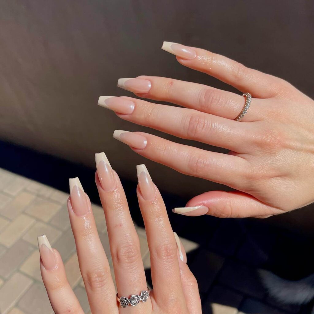 Elegant pearl nails featuring natural to acrylic designs, explore pearl nails for weddings, proms, and formal occasions.