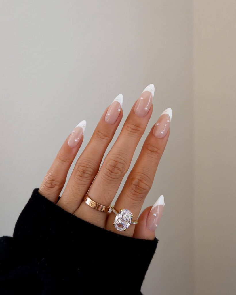 Elegant pearl nails featuring natural to acrylic designs, explore pearl nails for weddings, proms, and formal occasions.