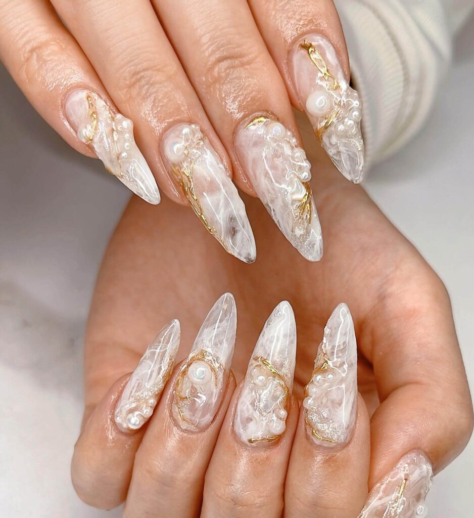 Elegant pearl nails featuring natural to acrylic designs, explore pearl nails for weddings, proms, and formal occasions.