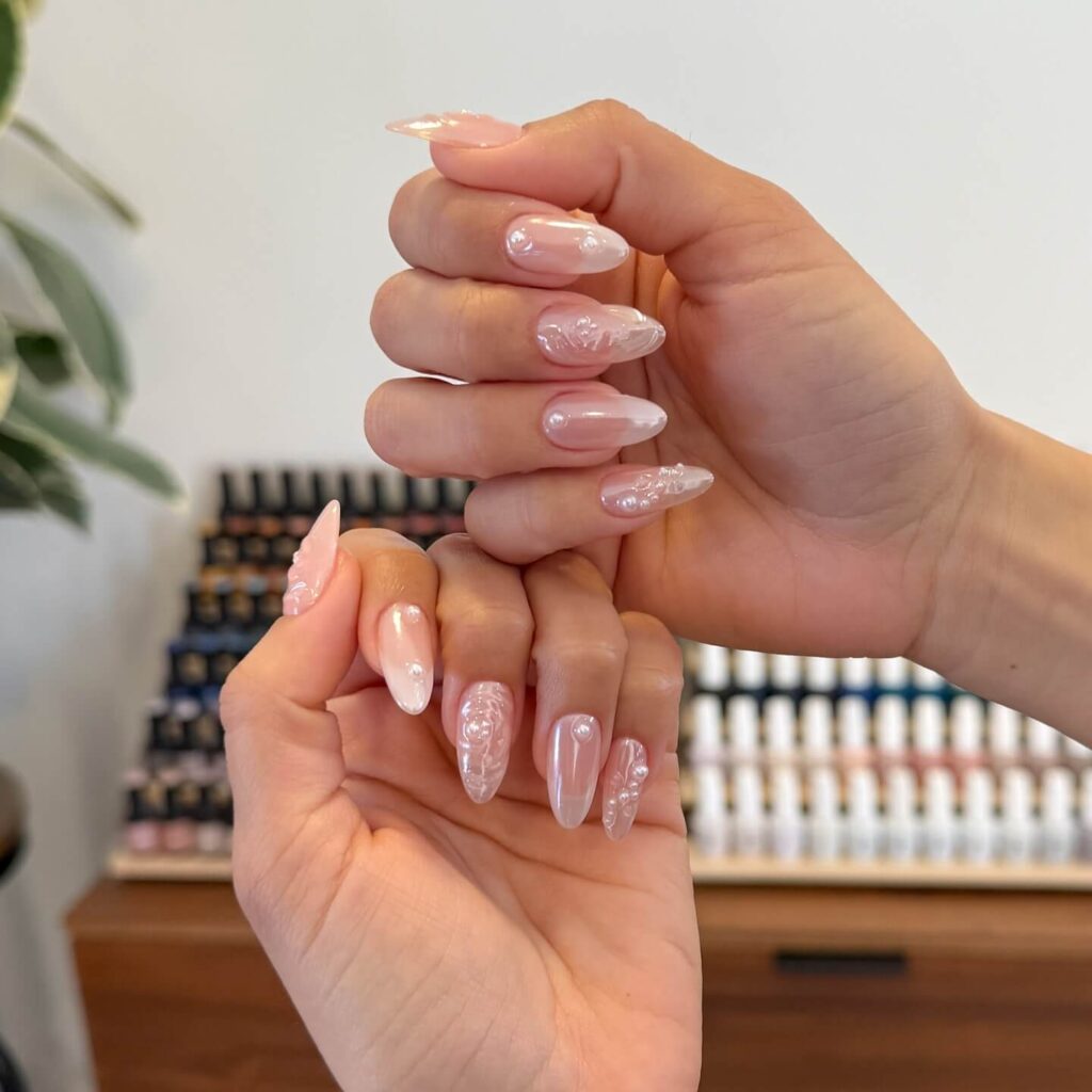 Elegant pearl nails featuring natural to acrylic designs, explore pearl nails for weddings, proms, and formal occasions.