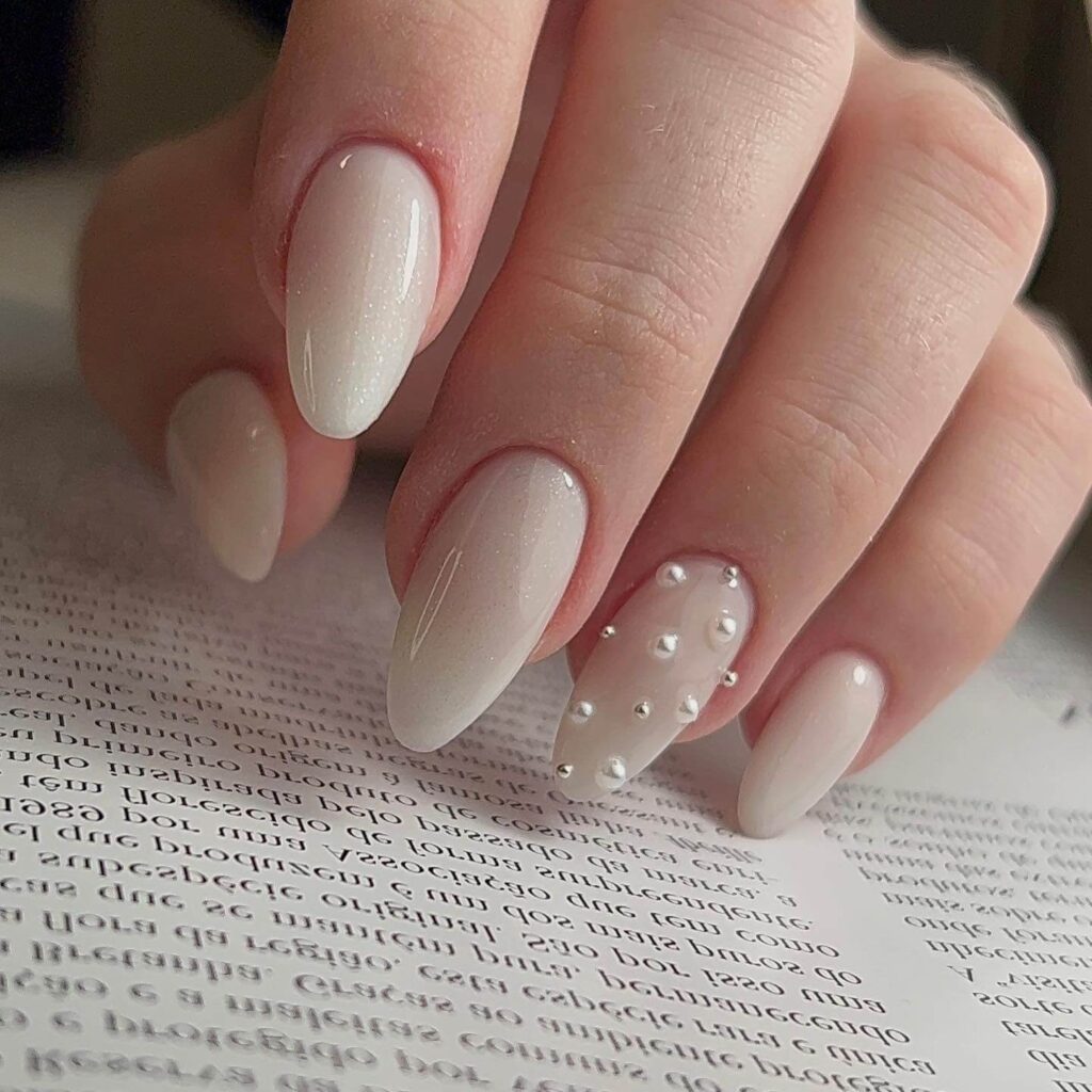 Elegant pearl nails featuring natural to acrylic designs, explore pearl nails for weddings, proms, and formal occasions.