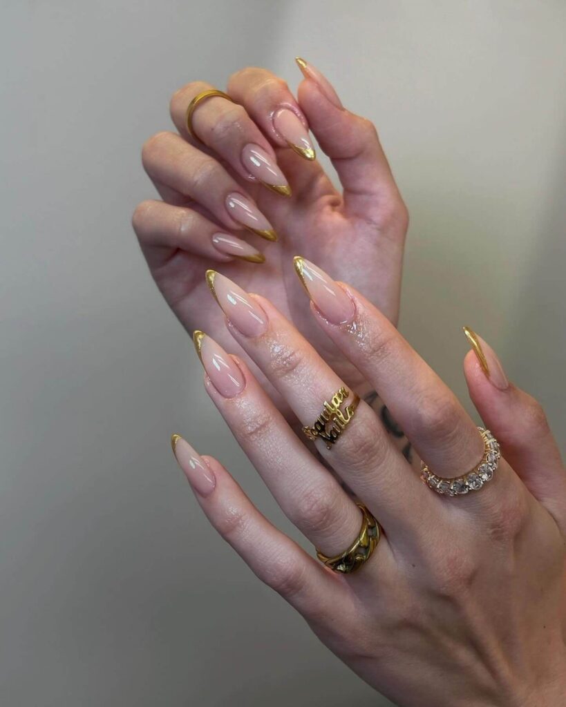 A collection of stiletto nails featuring bold designs, from acrylic and minimalist to glitter and ombre finishes for a dramatic and elegant manicure. 