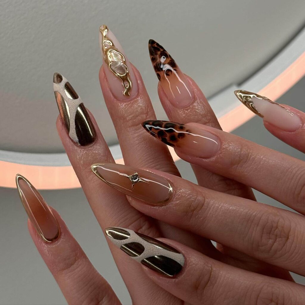 A collection of stiletto nails featuring bold designs, from acrylic and minimalist to glitter and ombre finishes for a dramatic and elegant manicure. 