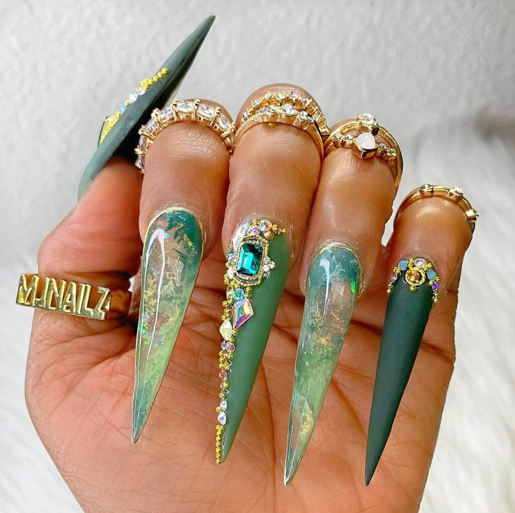 A collection of stiletto nails featuring bold designs, from acrylic and minimalist to glitter and ombre finishes for a dramatic and elegant manicure. 