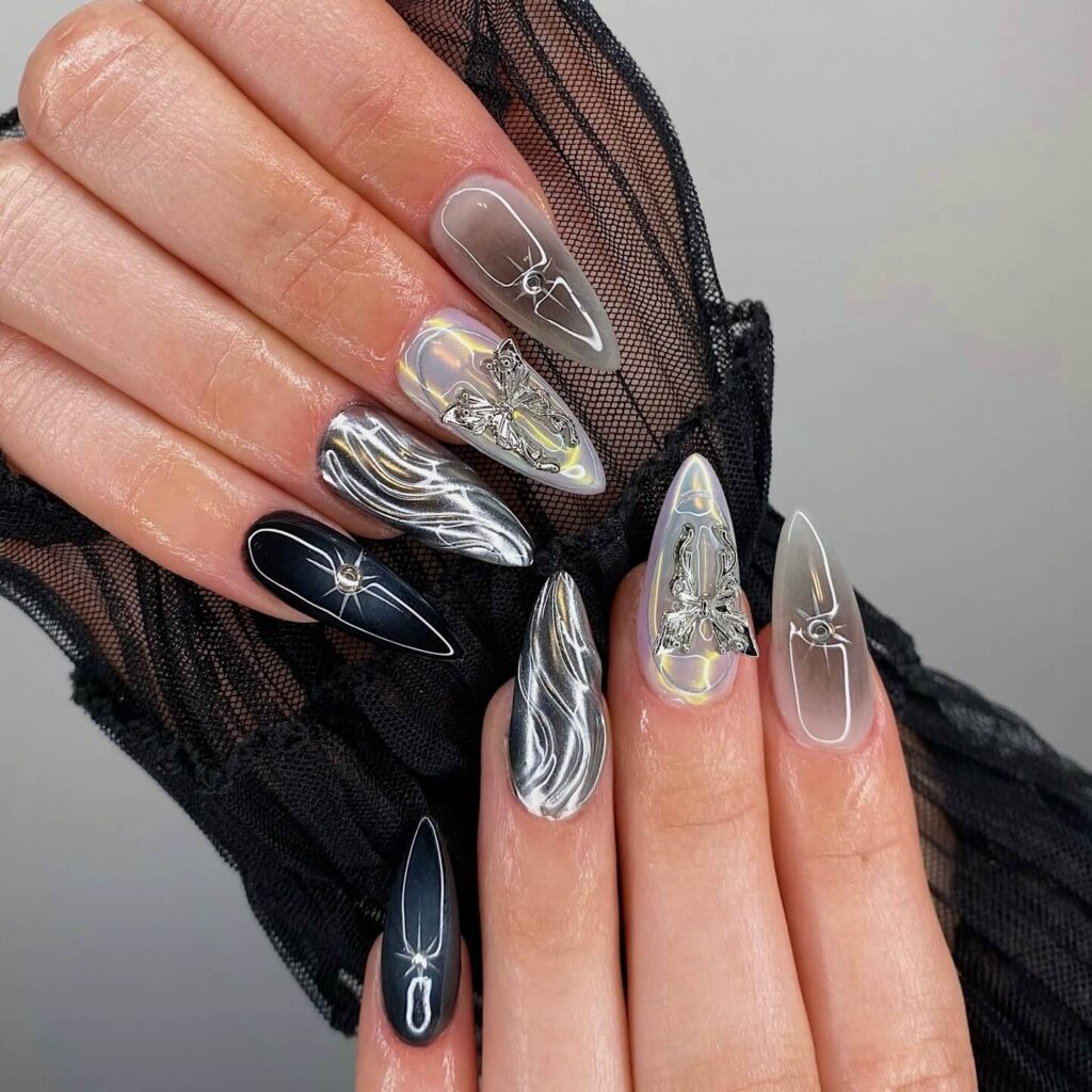 A collection of stiletto nails featuring bold designs, from acrylic and minimalist to glitter and ombre finishes for a dramatic and elegant manicure. 