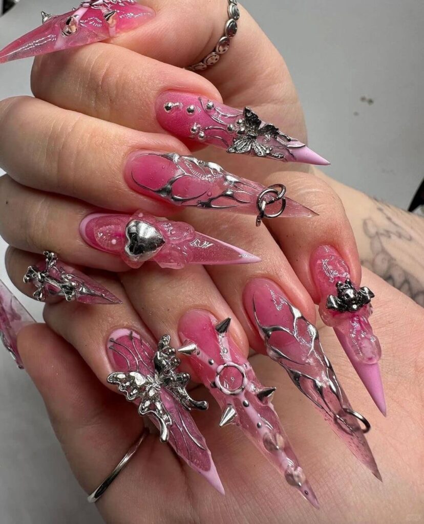 A collection of stiletto nails featuring bold designs, from acrylic and minimalist to glitter and ombre finishes for a dramatic and elegant manicure. 