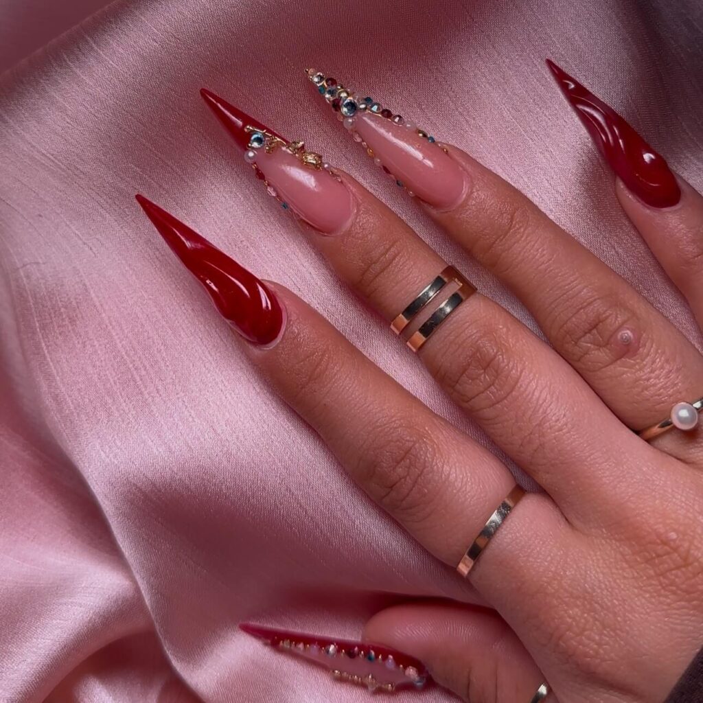 A collection of stiletto nails featuring bold designs, from acrylic and minimalist to glitter and ombre finishes for a dramatic and elegant manicure. 