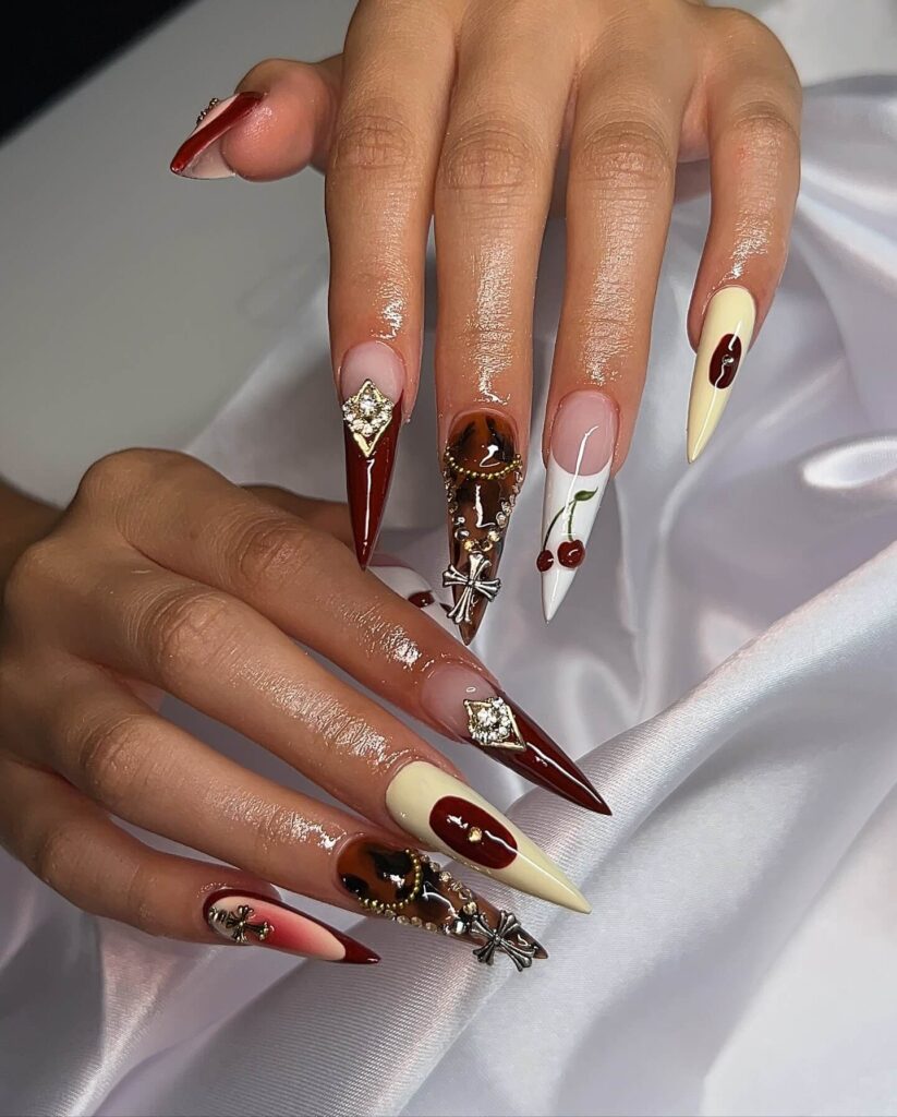 A collection of stiletto nails featuring bold designs, from acrylic and minimalist to glitter and ombre finishes for a dramatic and elegant manicure. 