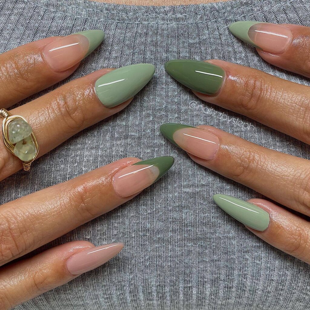 Freshly painted sage green nails with a minimalist design. This muted green nail polish trend is perfect for a subtle, nature-inspired manicure.