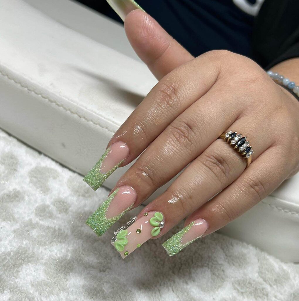 Freshly painted sage green nails with a minimalist design. This muted green nail polish trend is perfect for a subtle, nature-inspired manicure.