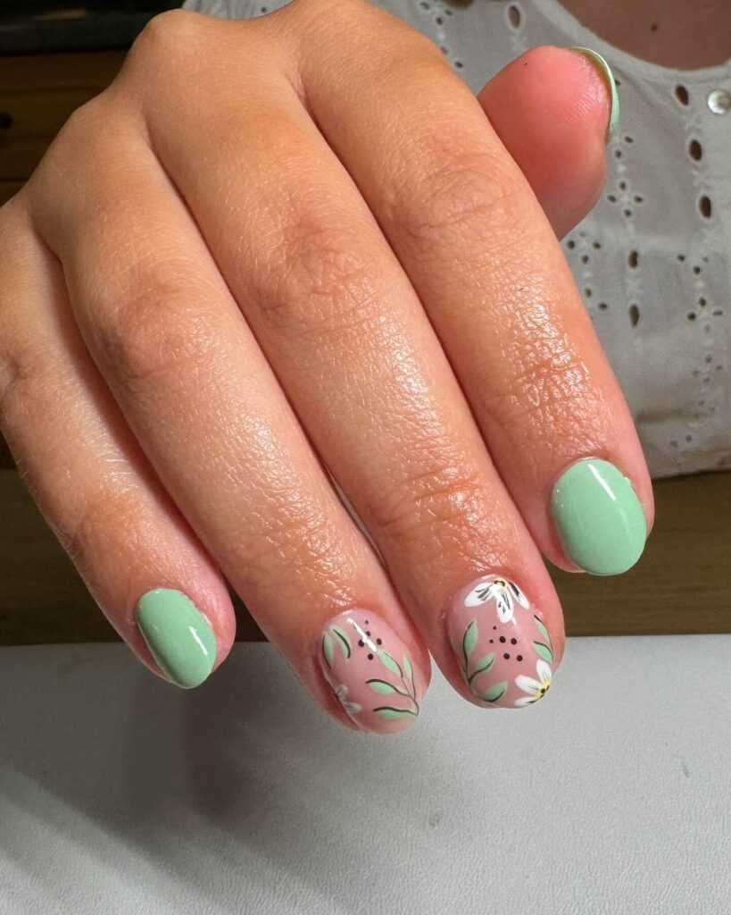 Freshly painted sage green nails with a minimalist design. This muted green nail polish trend is perfect for a subtle, nature-inspired manicure.