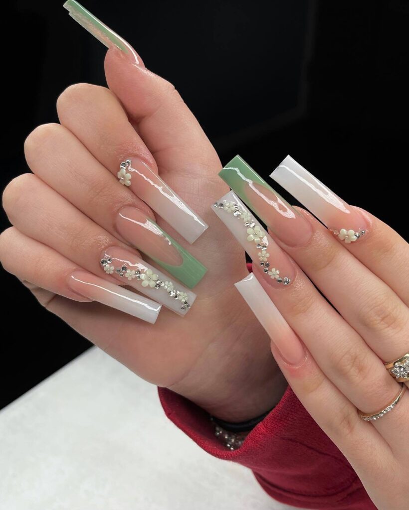 Freshly painted sage green nails with a minimalist design. This muted green nail polish trend is perfect for a subtle, nature-inspired manicure.