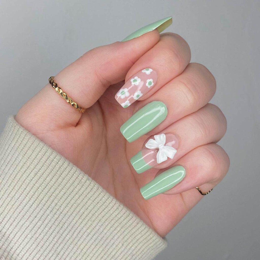 Freshly painted sage green nails with a minimalist design. This muted green nail polish trend is perfect for a subtle, nature-inspired manicure.