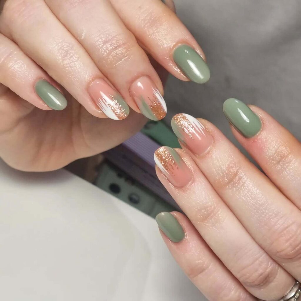 Freshly painted sage green nails with a minimalist design. This muted green nail polish trend is perfect for a subtle, nature-inspired manicure.